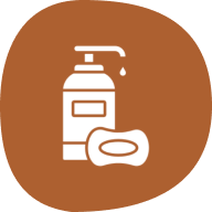 Lotion bottle and soap on brown background.