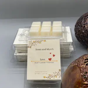 Stacked clear containers with white sweets and a decorative card.