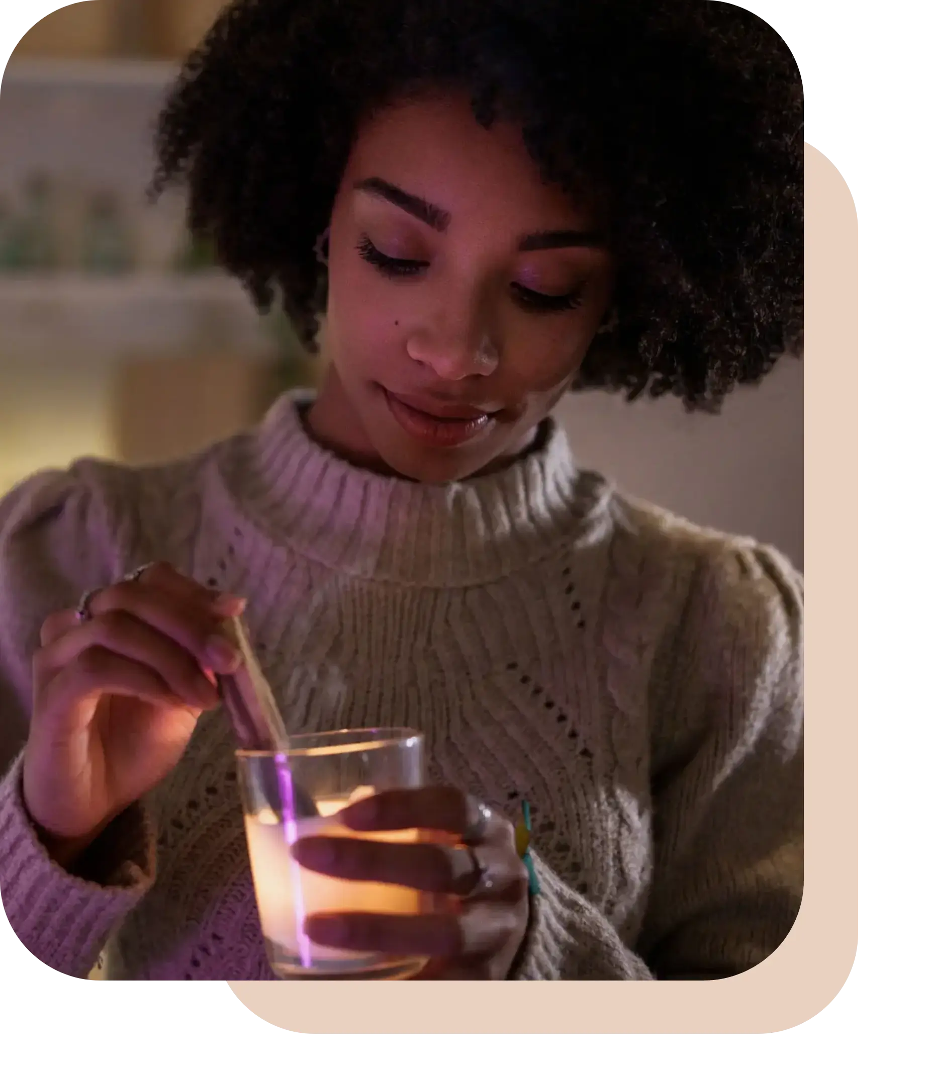 Woman lighting a candle with a match.